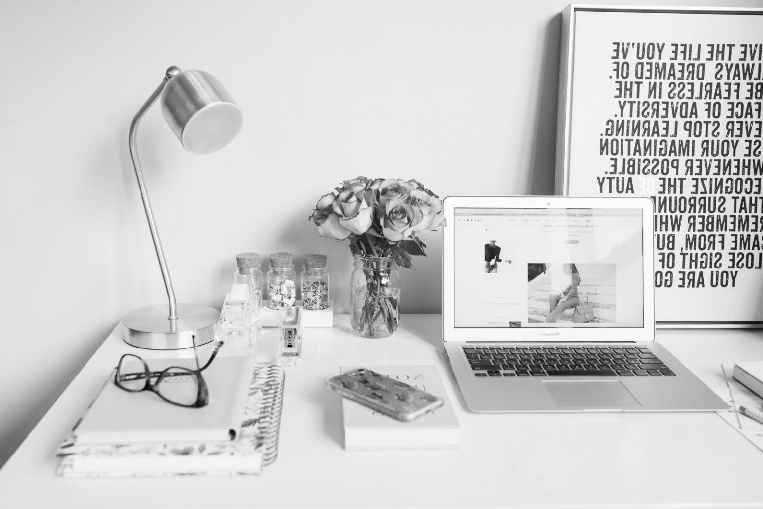 Financial planning documents and charts spread across a conference table during a business strategy session