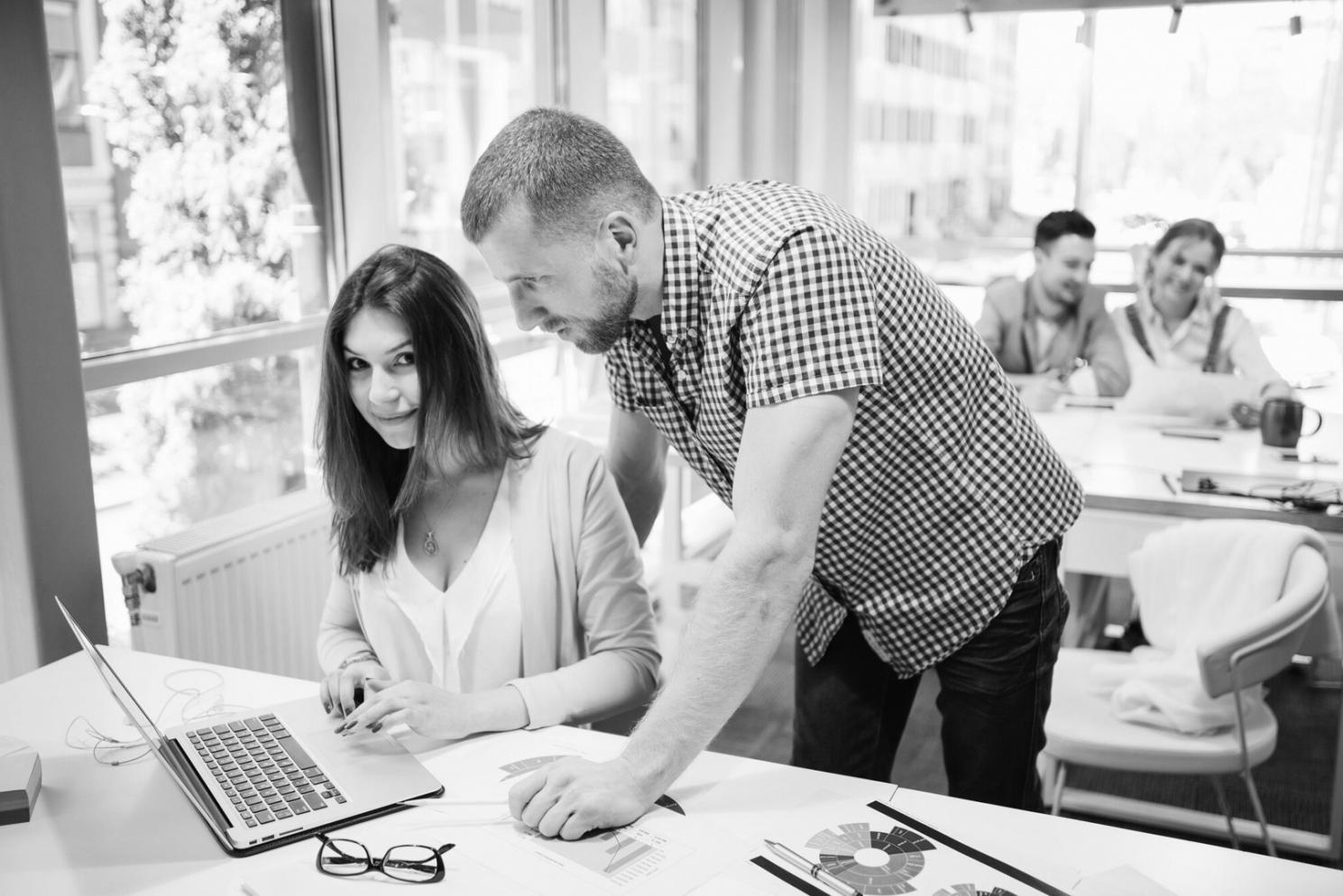 Family meeting with financial advisor reviewing investment portfolio