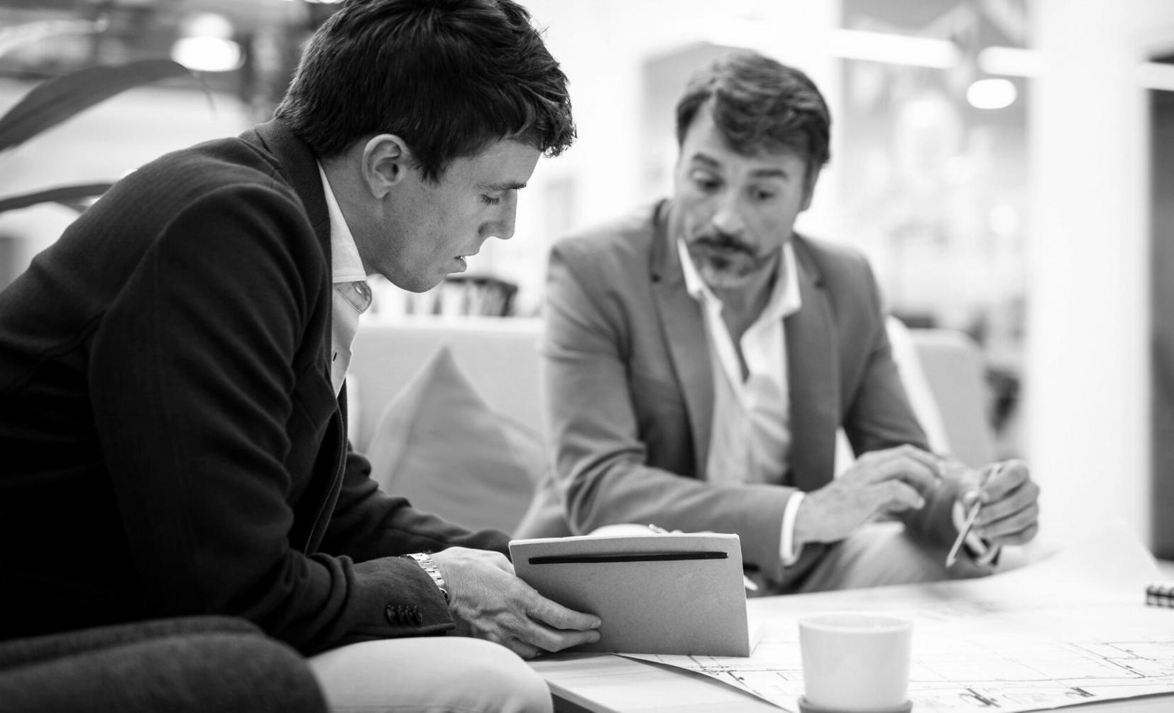 Business professionals collaborating in a modern conference room during a financial planning workshop